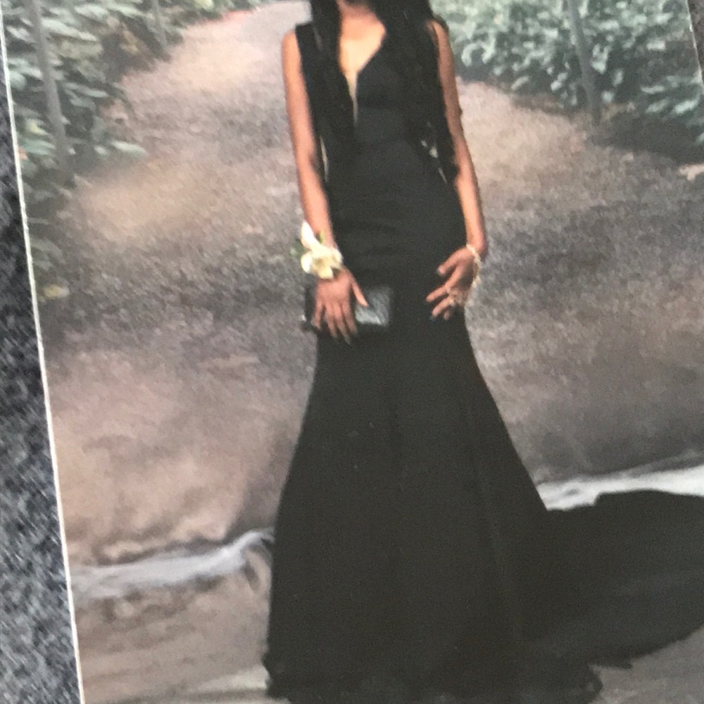 Pretty floor length black dress .